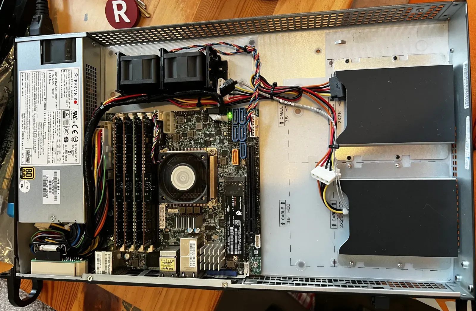 Inside the 1U: three 40mm fans, an active heatsink, and 128GiB of ECC DDR4.